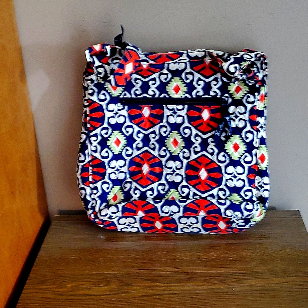 A Vera Bradly Shoulder bag. Colors are mainly orange, white, green and dark blue